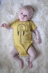 Image of Unisex Organic Baby Onesie: Whisk + Headphones (Dijon)