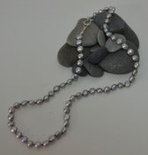 Image of Small Pale Pearl Silver Coins 