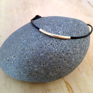 Image of leather & large gold bar bracelet