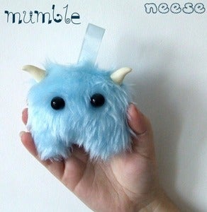 Image of In stock - Mumbles. Red, blue and grey.