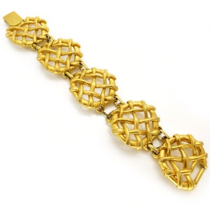 Image of Vintage Signed Sphinx Gold Tone Cross Over Waffle Bracelet