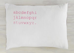Image of alphabet pillow white with neon pink text