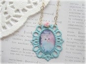 Image of White Kitten in Blue Frame with Pink Flower Necklace