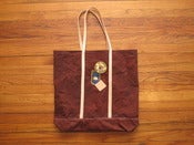 Image of rust waxed canvas tote