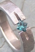 Image of Titanium Ground Notch Band .28 Carat Appraised Princess Cut Blue Diamond Ring
