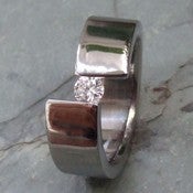 Image of Titanium Tension Set Rings Off Center Band Quarter Carat Diamond