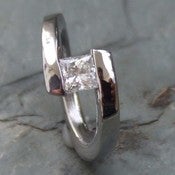 Image of Titanium Twist of Fate Tension Set Band Princess Cut 1/2 Carat Certified Near Colorless Diamond Ring