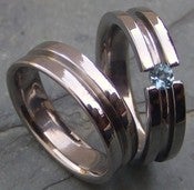 Image of Titanium Striped Tension Set Band - Brilliant Cut Light Blue Aquamarine Wedding Ring Set