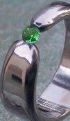 Image of Titanium Ring Band Tapered Tension Set Round Tsavorite Green Garnet