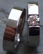 Image of Titanium Shiny Tension Set Half Carat Certified Near Colorless Diamond Ring and Wedding Band SET