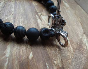 Image of Lava Rocks, Skull, Gun & Cuffs.