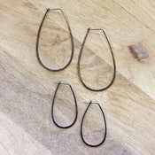 Image of rhodium silver oval hoops