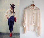 Image of sheer nude blouse 