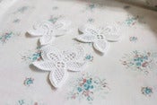 Image of white orchid motifs
