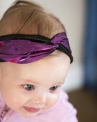 Image of tiny metallic purple and black turban