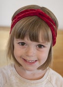 Image of red crushed velvet mini turban