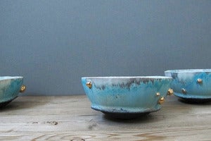 Image of turquoise blue monk bowl with gold inclusions