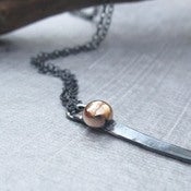 Image of crow - black silver and red gold necklace