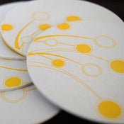 Image of dancing oranges letterpress coasters round, set of 8