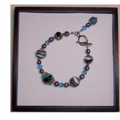 Image of swirly planet bracelet