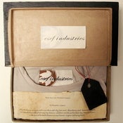 Image of hand made tshirts in a bookbox