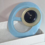 Image of vintage styled blue-themed buckle and button brooch