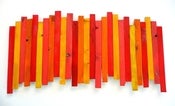 Image of Wood Wall Sculpture in Red, Orange, Yellow and Melon