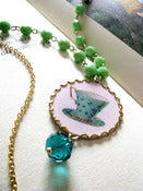Image of alice's tea cup necklace