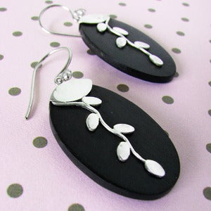 Image of leaf vines on a black wall earrings