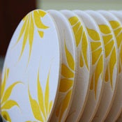 Image of yellow flower pattern, letterpress coasters set of 8