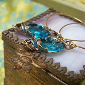 Image of Golden Spiral Hammered hoops in Zircon