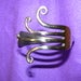 Image of forked swirly bangle