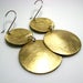 Image of inside out disks. earrings. brass.