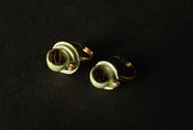 Image of green and gold ring