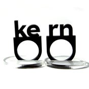 Image of typographic kern acrylic ring set