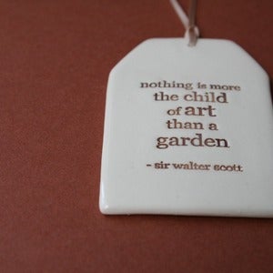 Image of ceramic quote tag - child of art