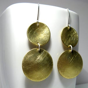 Image of inside out disks. earrings. brass.