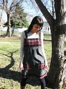 Image of gray pinstripe and maroon and black plaid jumper