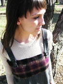Image of gray pinstripe and maroon and black plaid jumper