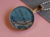 Image of custom destination vintage map necklace. shiny sterling