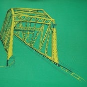 Truss bridge on grass gren $25