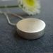 Image of mini silver disc pendant
