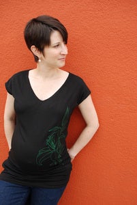 Image of lily on black banded maternity tunic