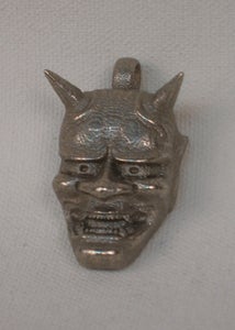 Image of Hannya mask pendant by Matthew Amey