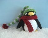 Image of Knitted Winter Penguin with hat and scarf Pattern. 