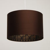 Image of Chocolate brown silk bespoke lampshade white light bulb print. 