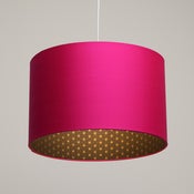 Image of Bright pink lampshade with screen printed gold geometric print