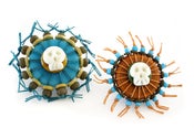 Image of skull brooches
