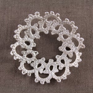 Image of doily brooch