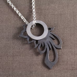 Image of black sunburst pendant